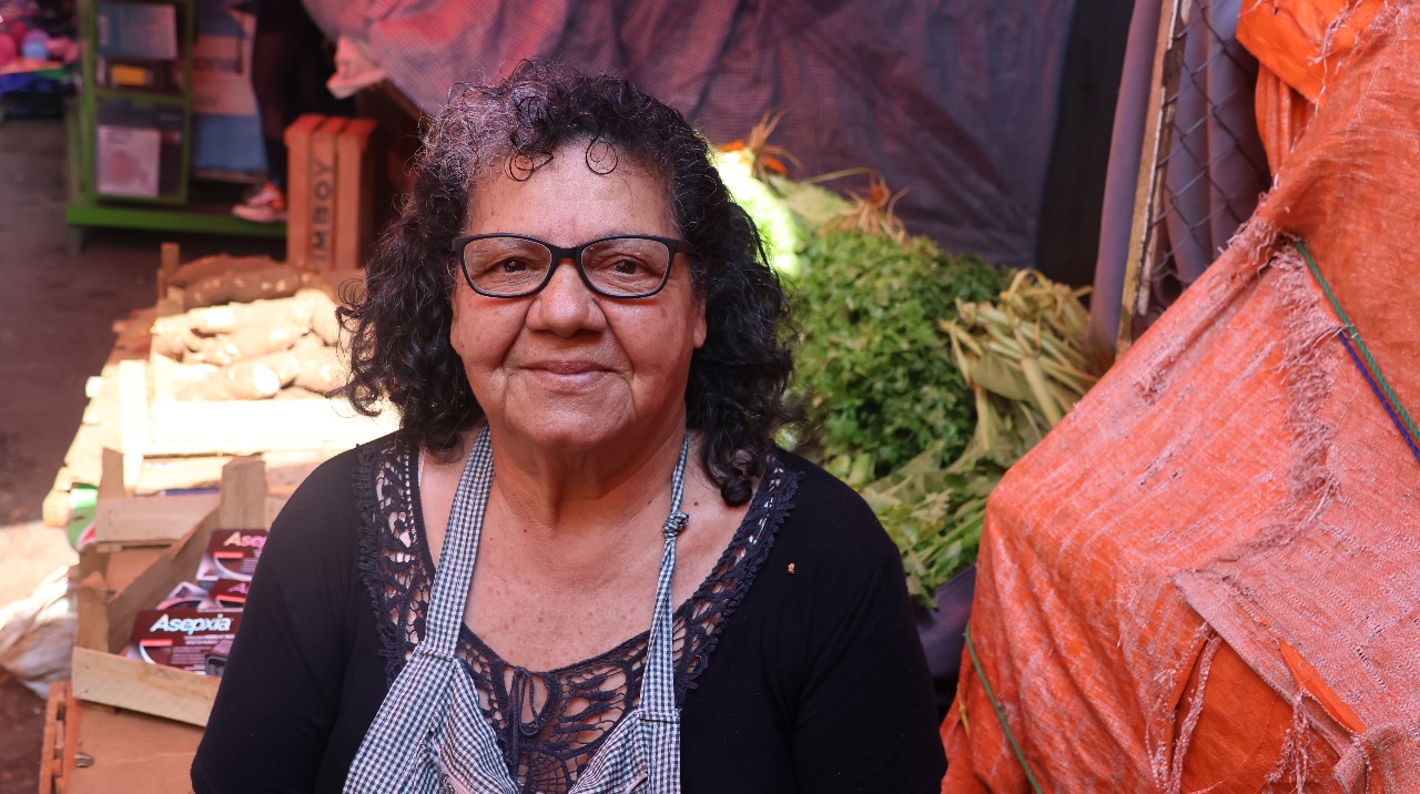 Close up of a woman wearing eyeglasses in a market