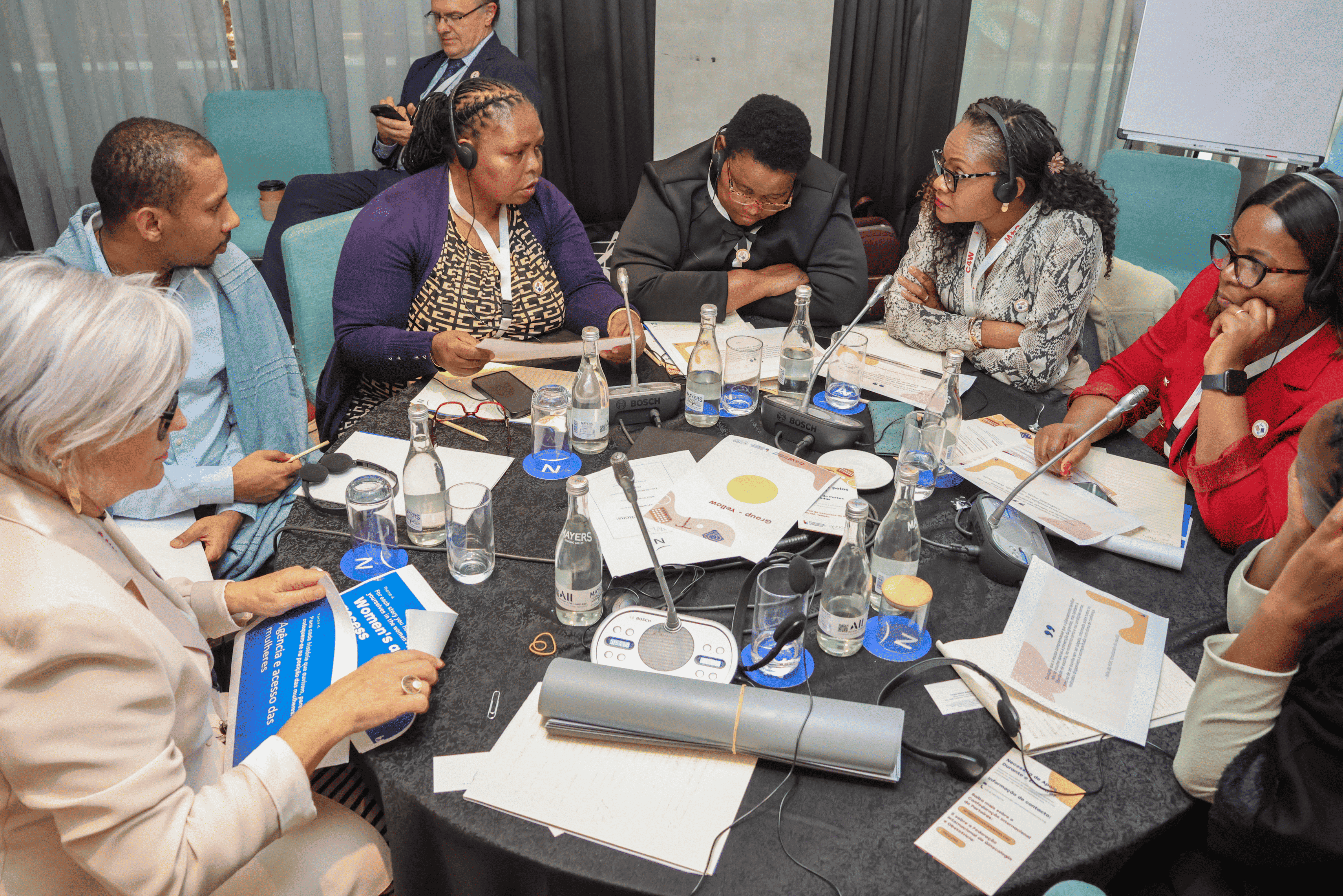Midwives, obstetricians-gynaecologists, and women’s advocacy groups from Mozambique working together in group session.