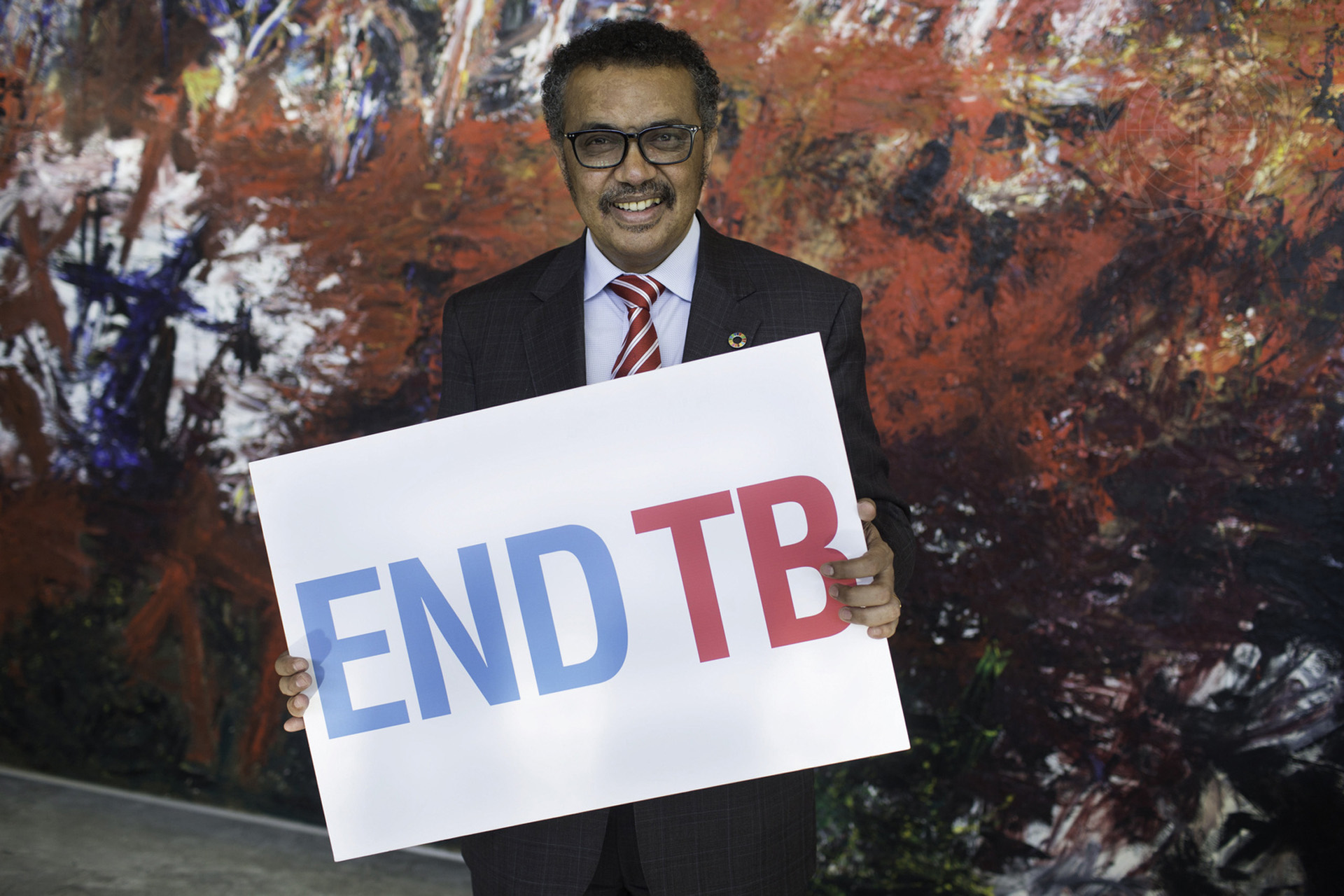 The Director-General Dr Tedros Adhanom Ghebreyesus at WHO headquarters in Geneva with a poster ENDTB, 6 October 2017.