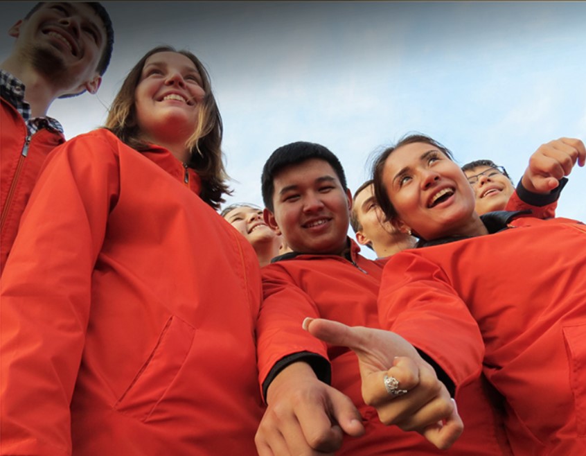 Group of teenagers wearing red jackets