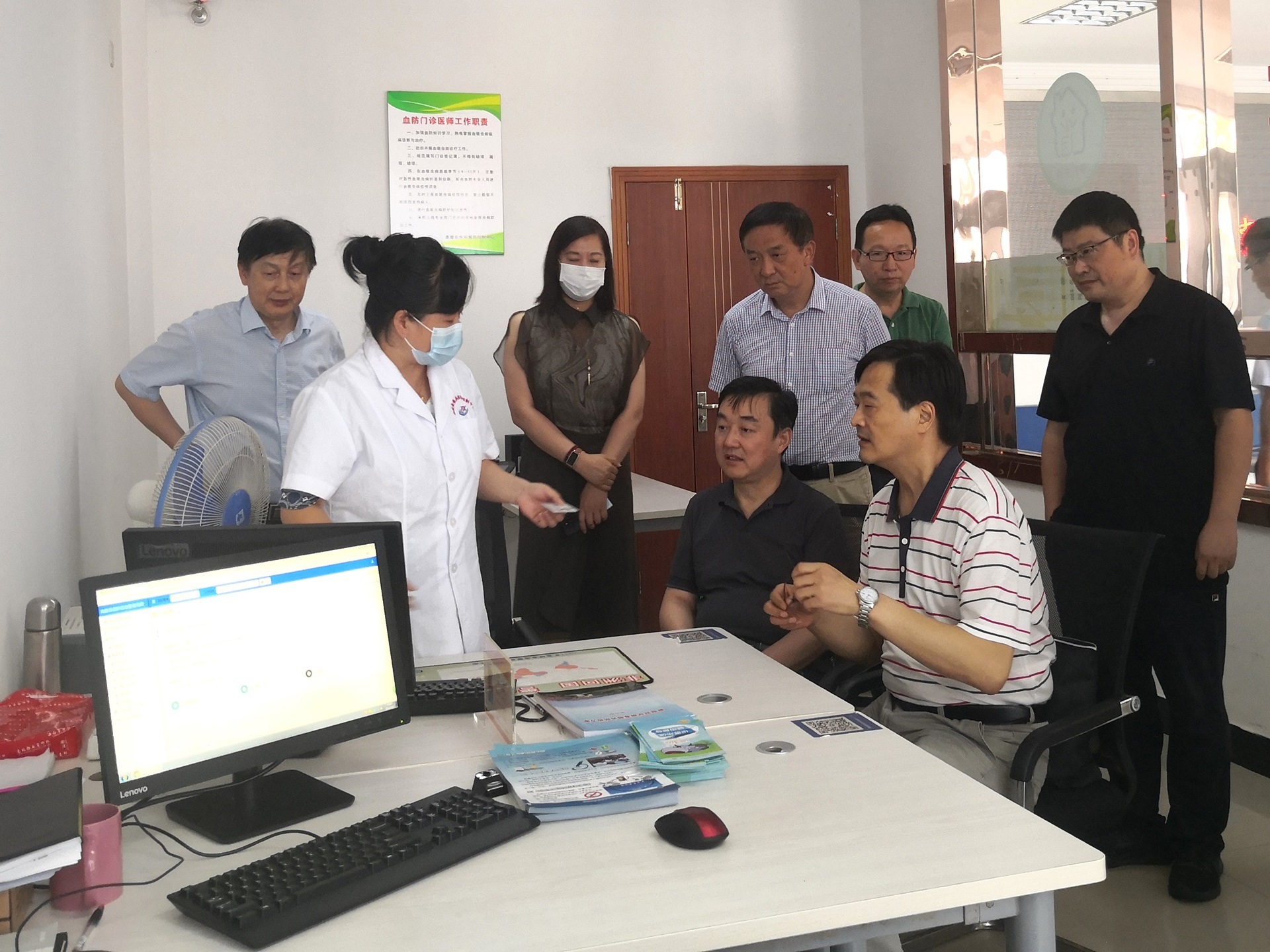 A group of people in a field work in China
