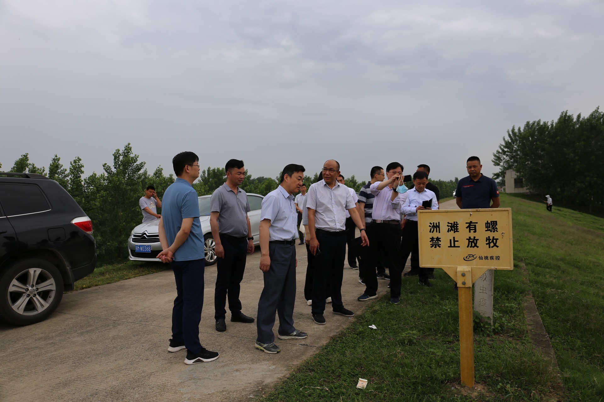 A group of people in a field work in China