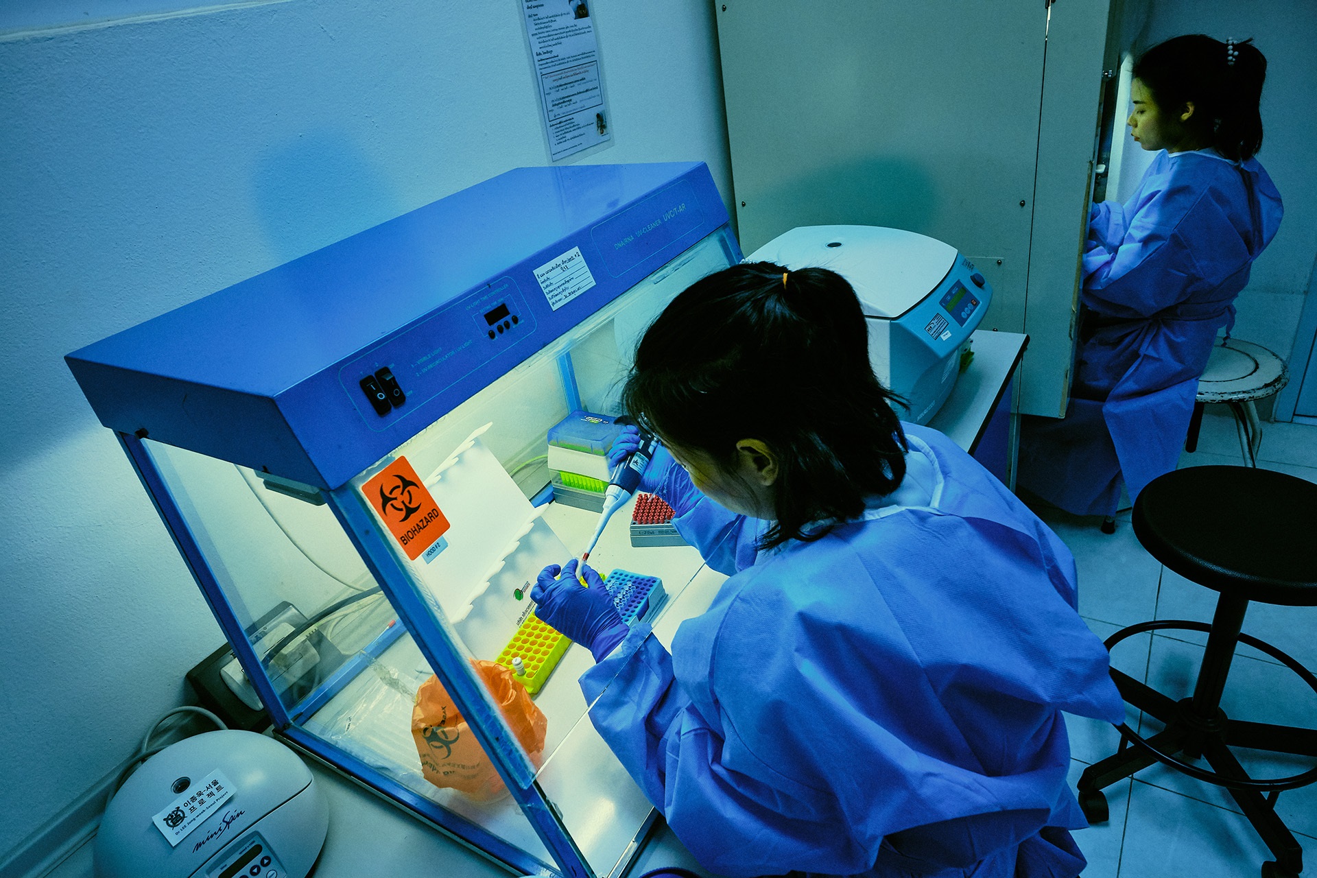 Laboratory technician performing a test in a clinical laboratory setting at the National Center for Laboratory and Epidemiology in the Lao People’s Democratic Republic.