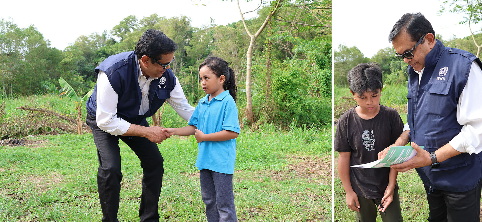 WHO representative interacts with two children outdoors, holding a vaccination record card during a health campaign.