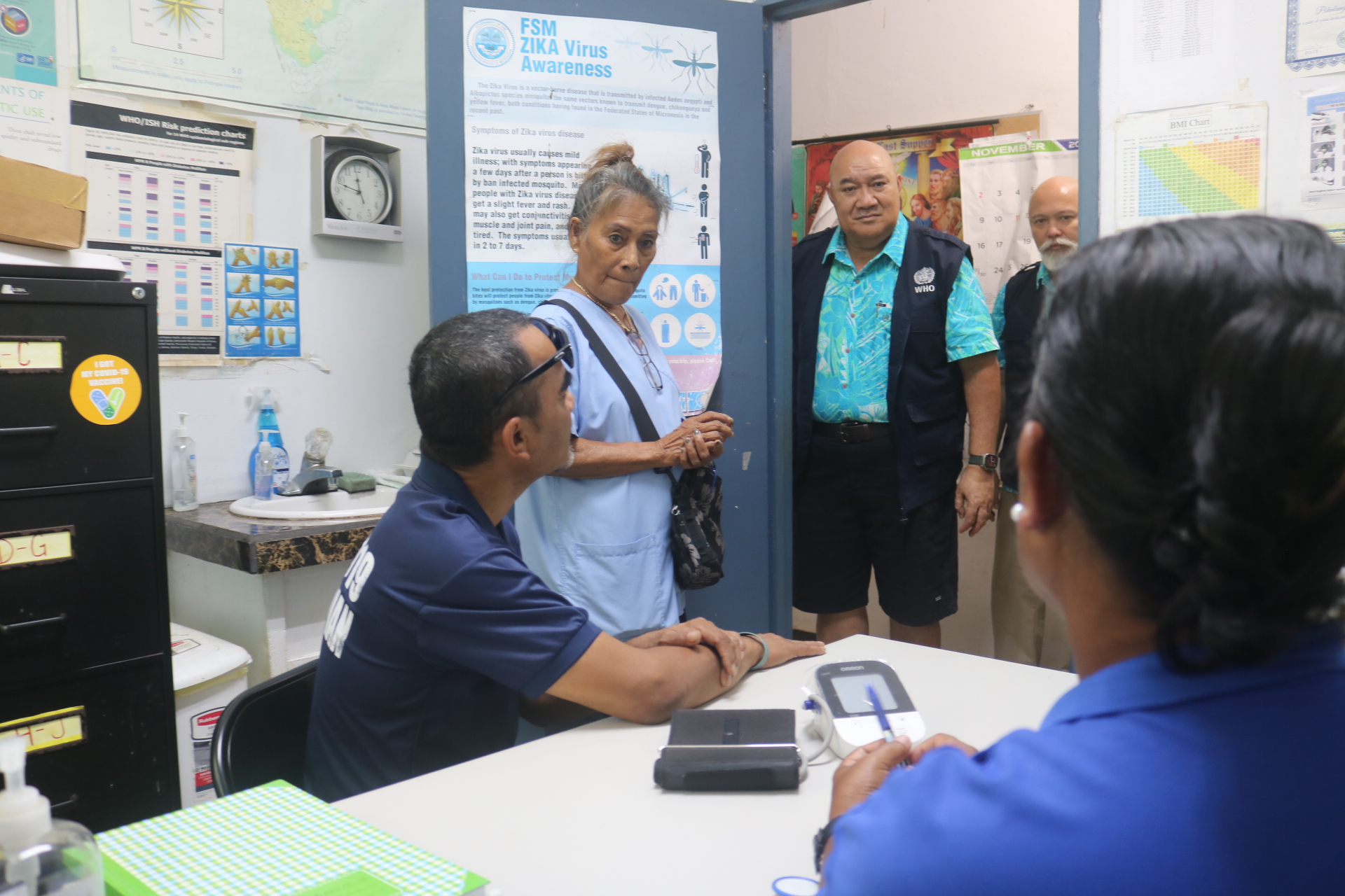 Regional Director Dr Saia Ma'u Piukala with health workers in a health facility in Micronesia