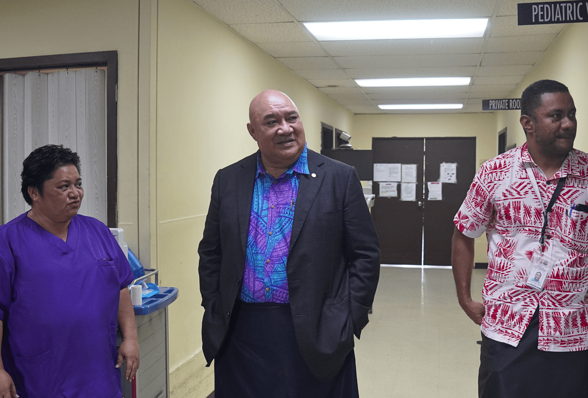 Three people inside a hospital in Micronesia