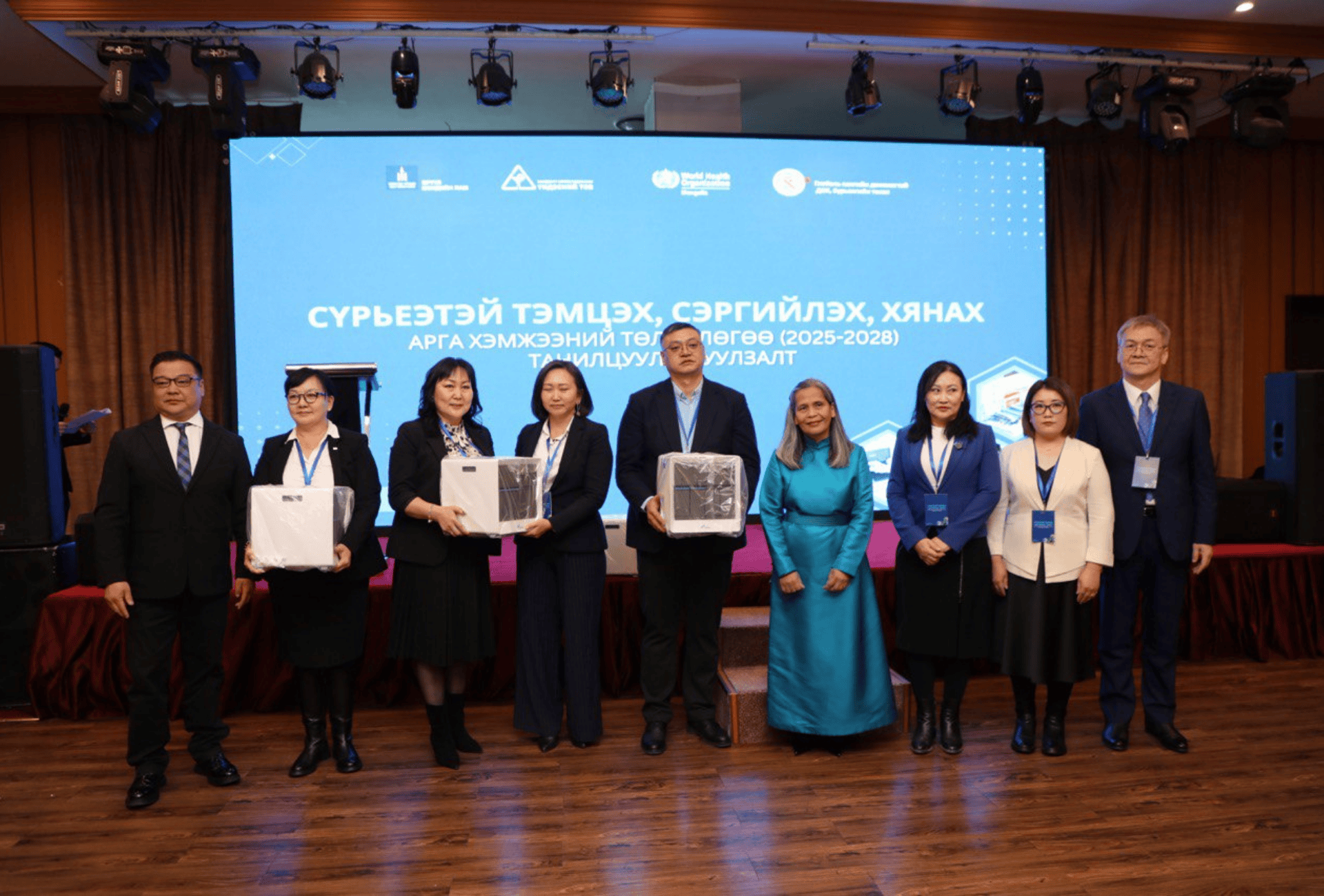 A group of people holding certificates