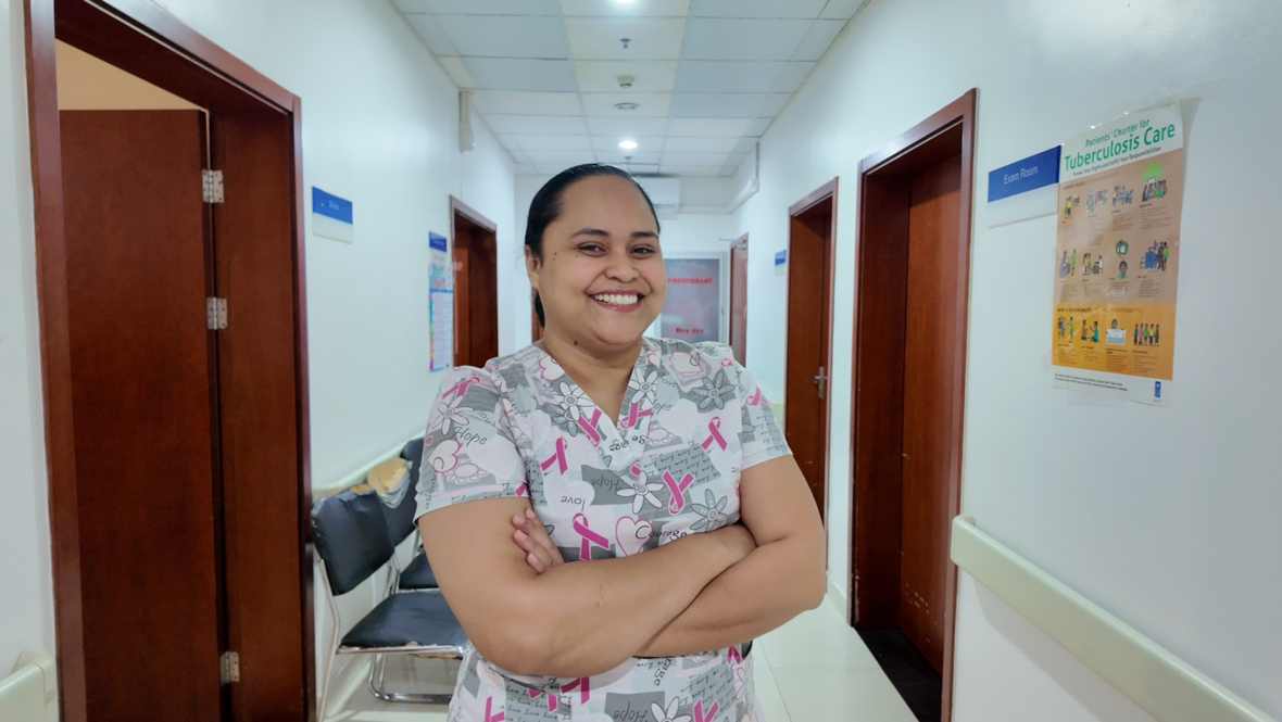 Dr Mayday Fanueli, in clinical attire, stands in a hallway at Tupua Tamasese Meaole Hospital.