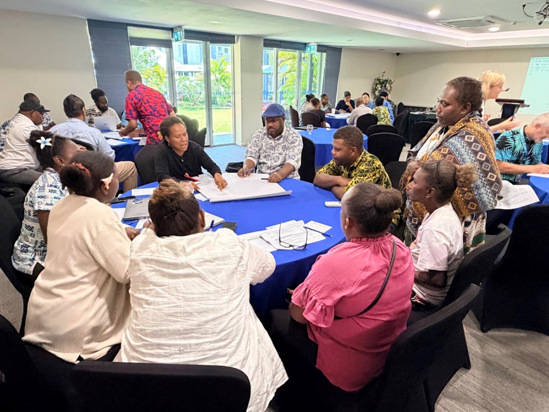 A facilitator looks after a group discussion