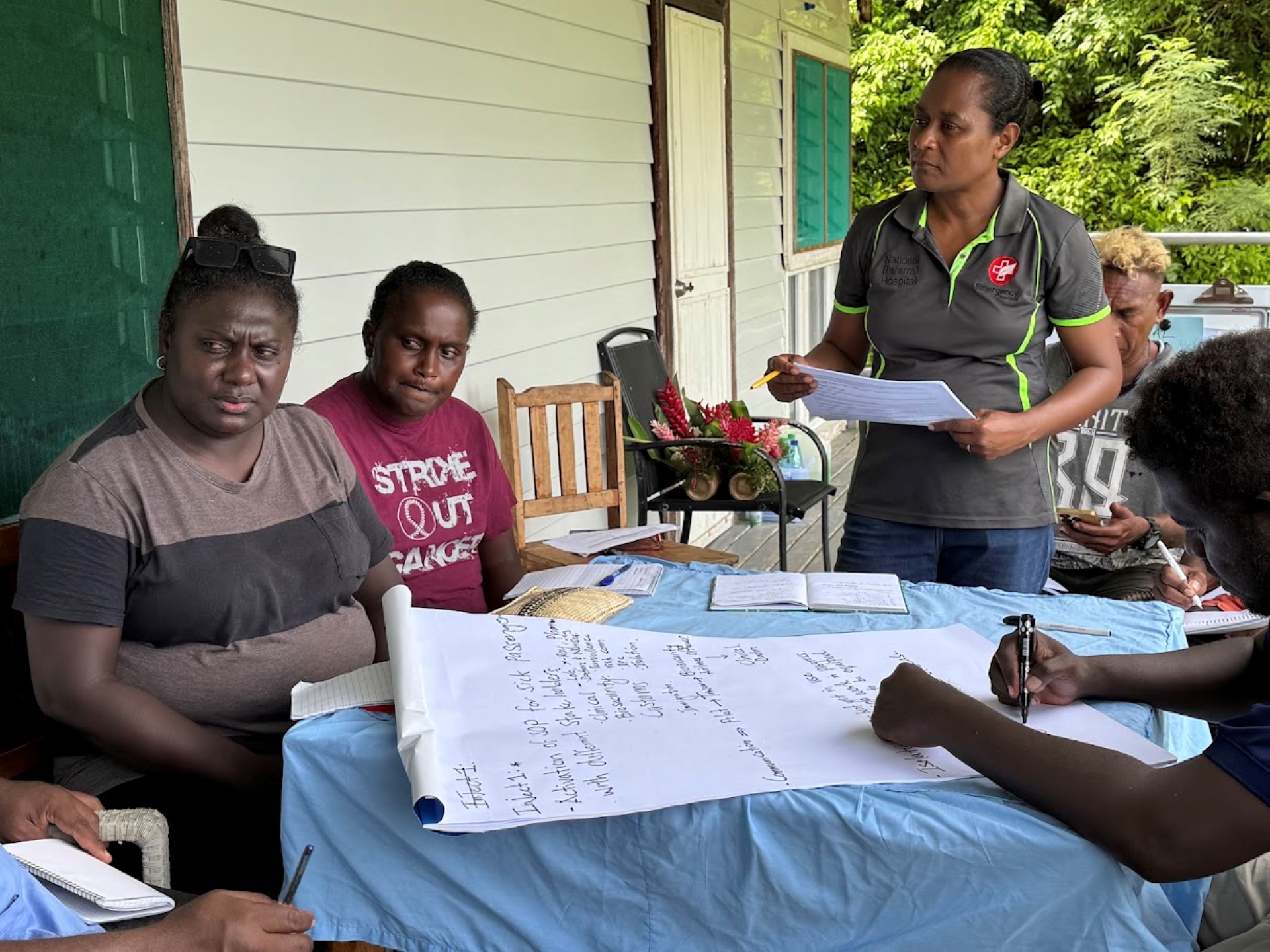 A woman leading the group conversation.