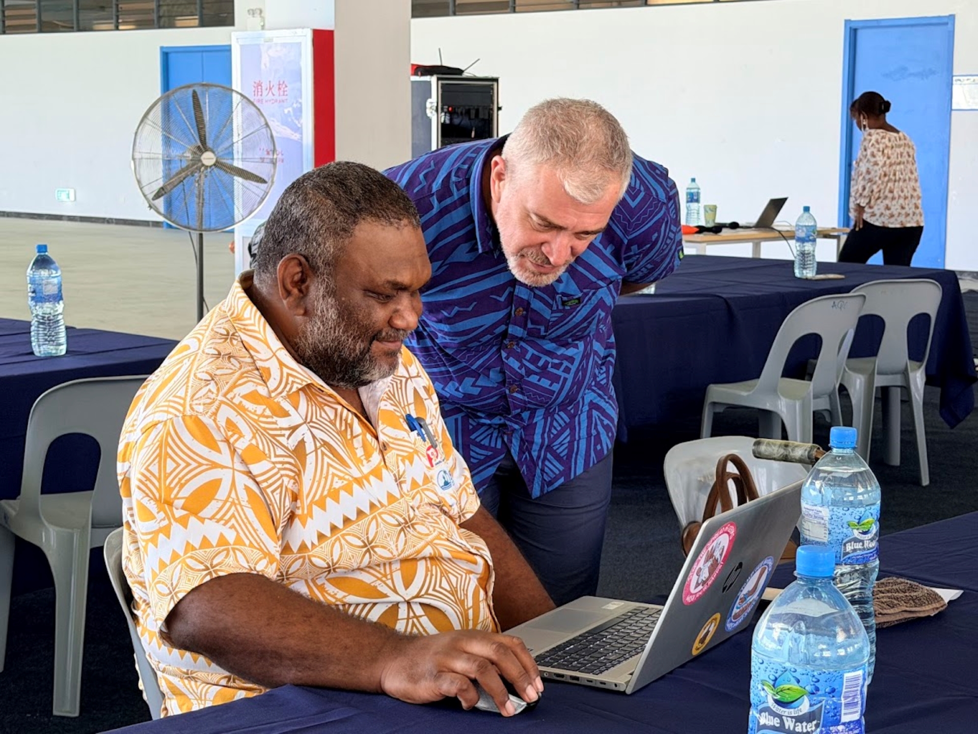 Two men collaborating.