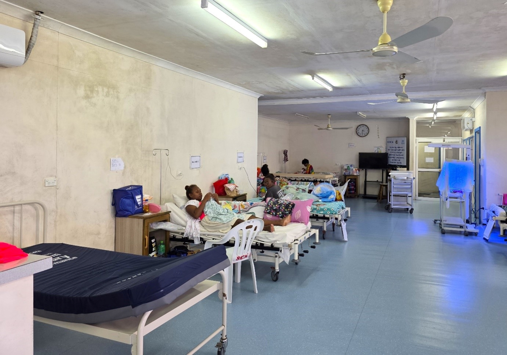 Mothers in a hospital ward.