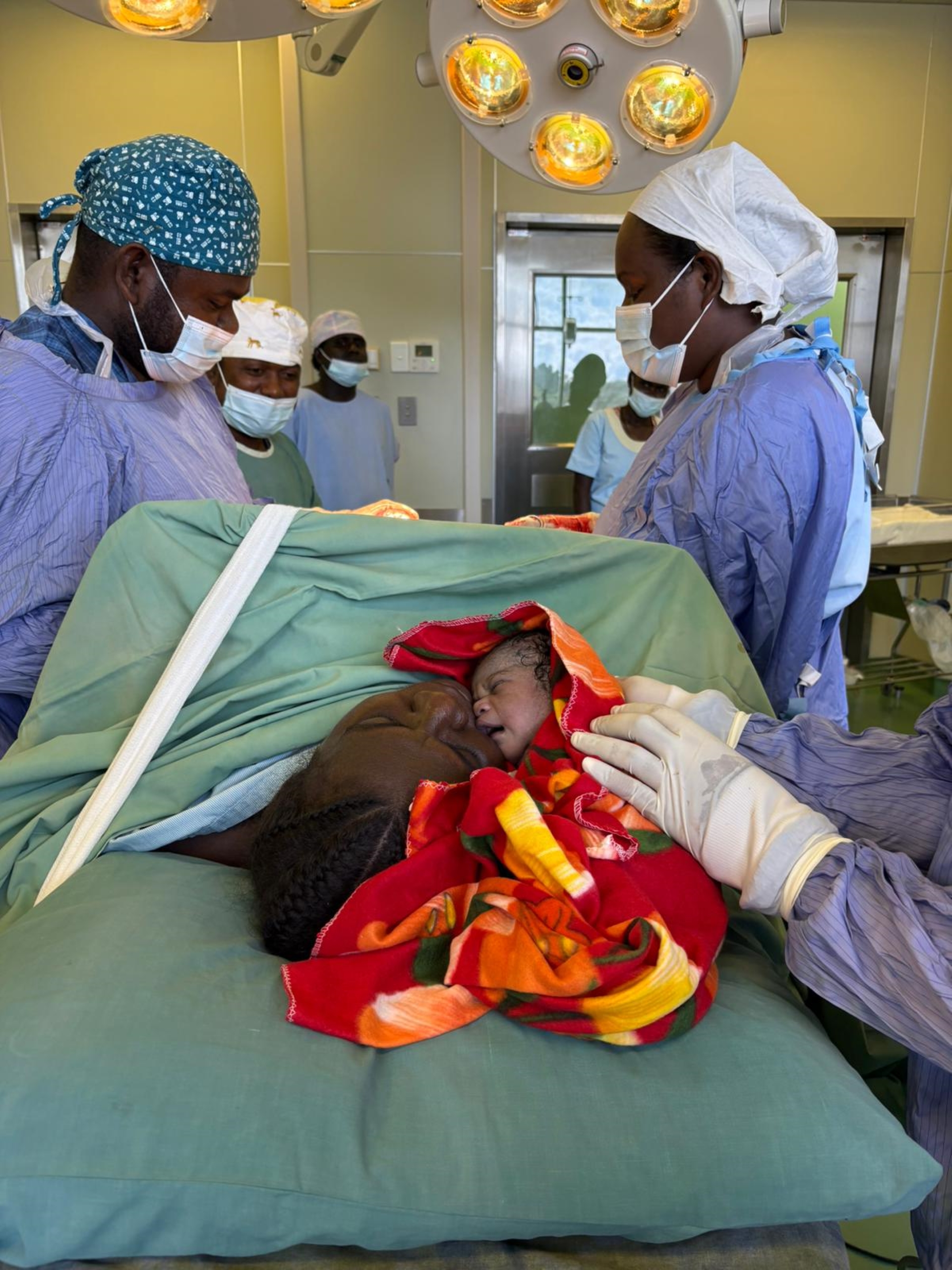 A baby being given skin-to-skin contact with mother
