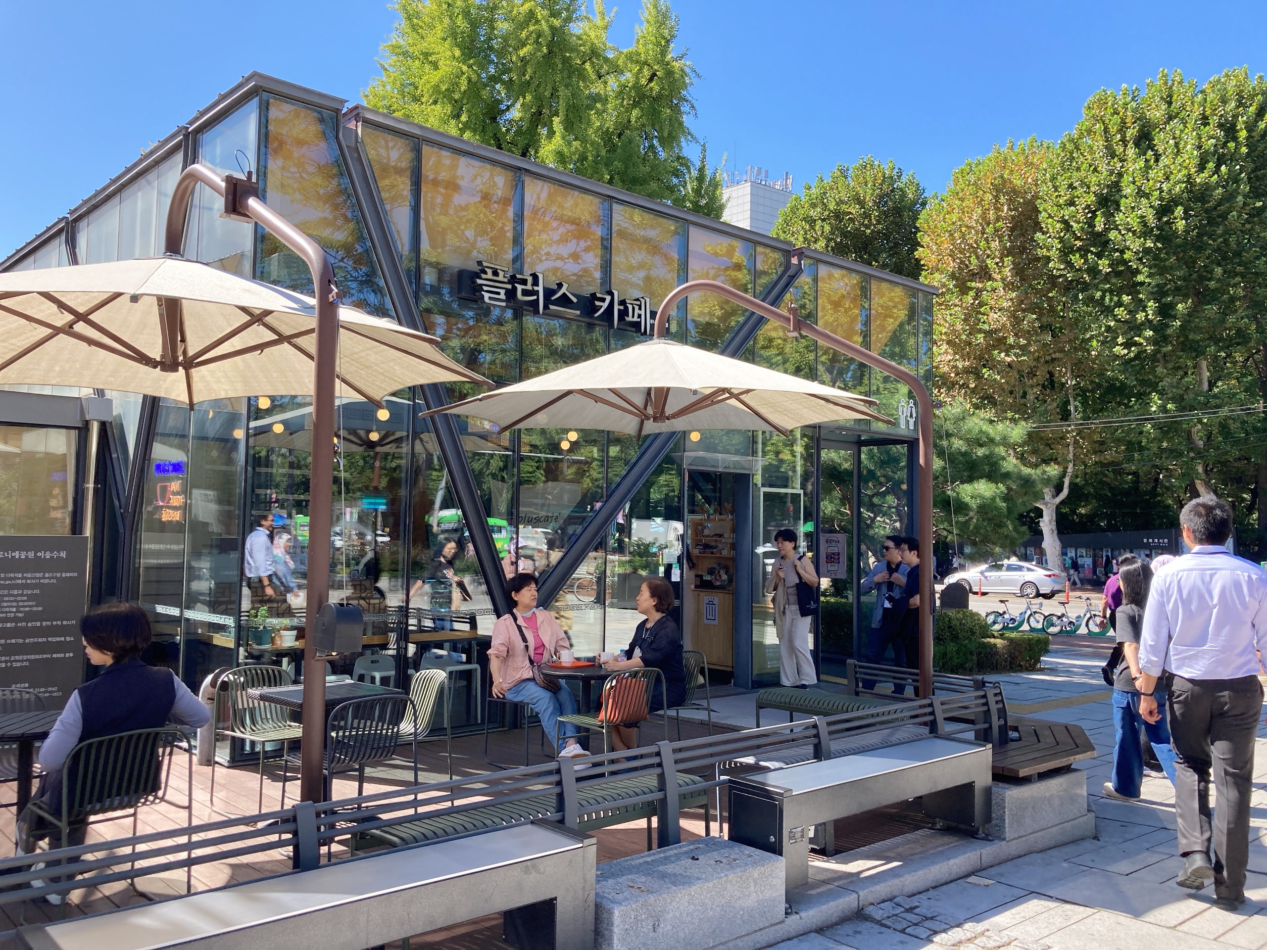 People enjoy the outdoors at a cafe in the Republic of Korea