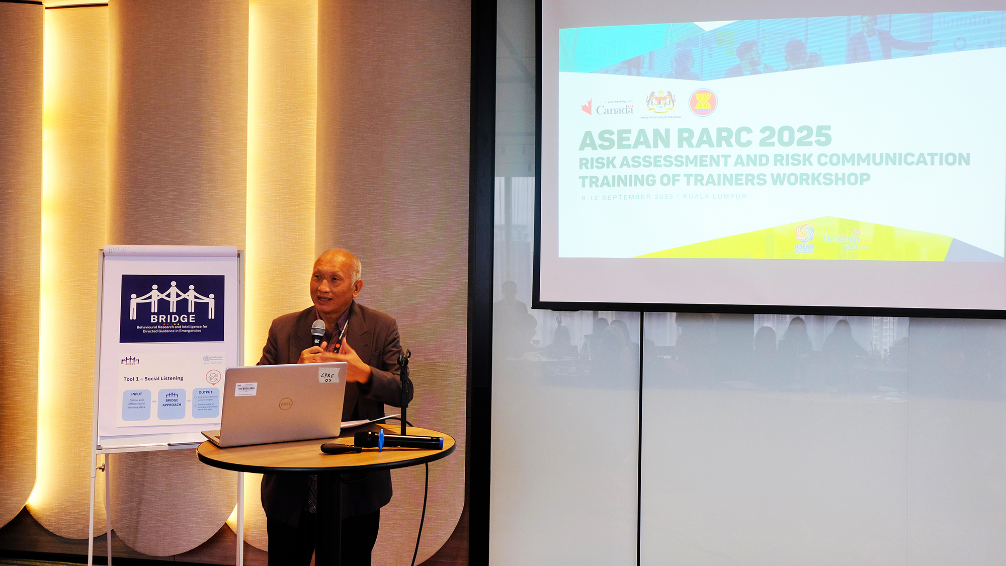 Participant presents slides during WHO's Risk Assessment and Risk Communication workshop