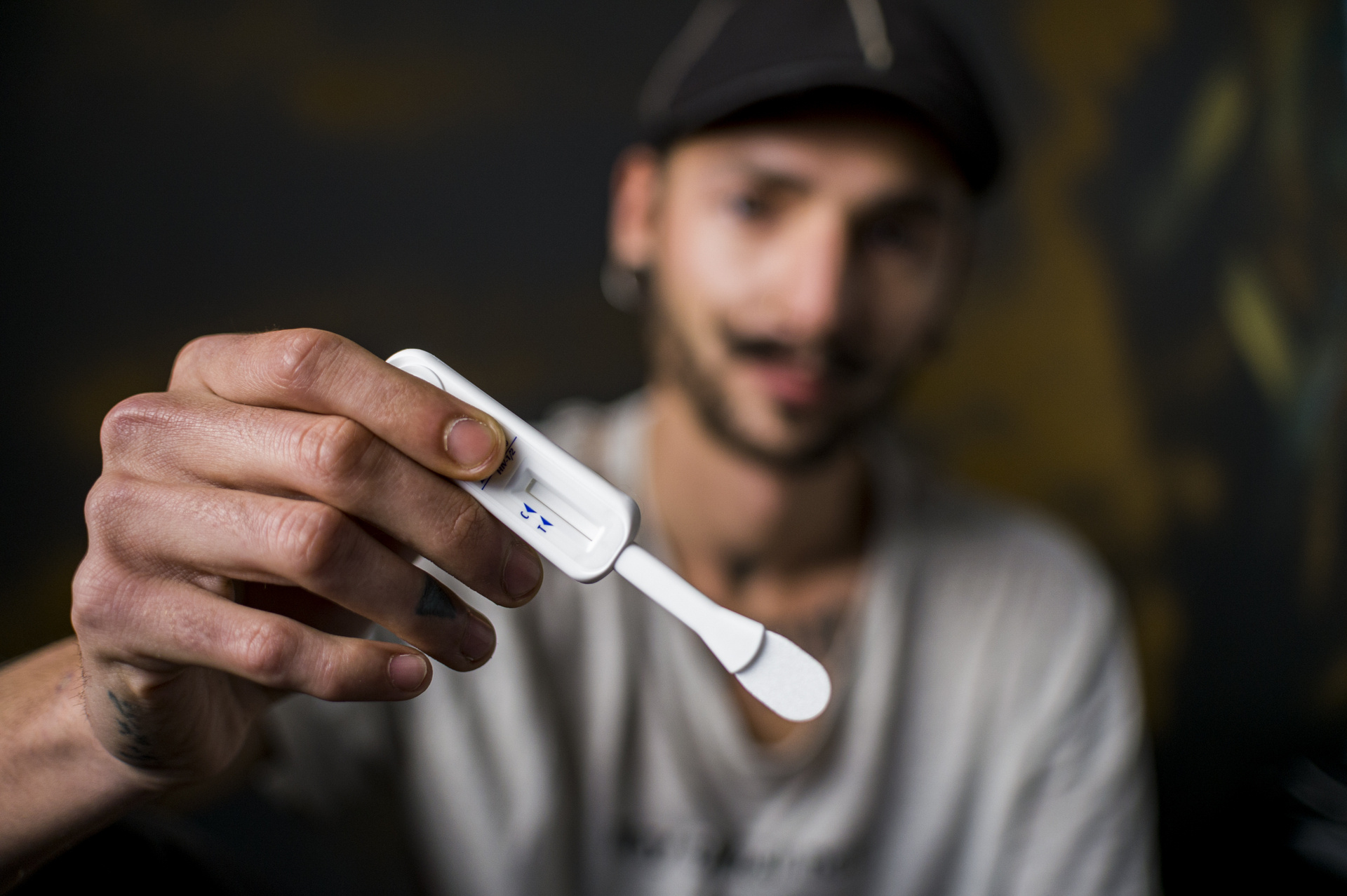 Man holding HIV self-test