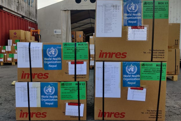 Boxes with medical supplies marked with the WHO Nepal logo