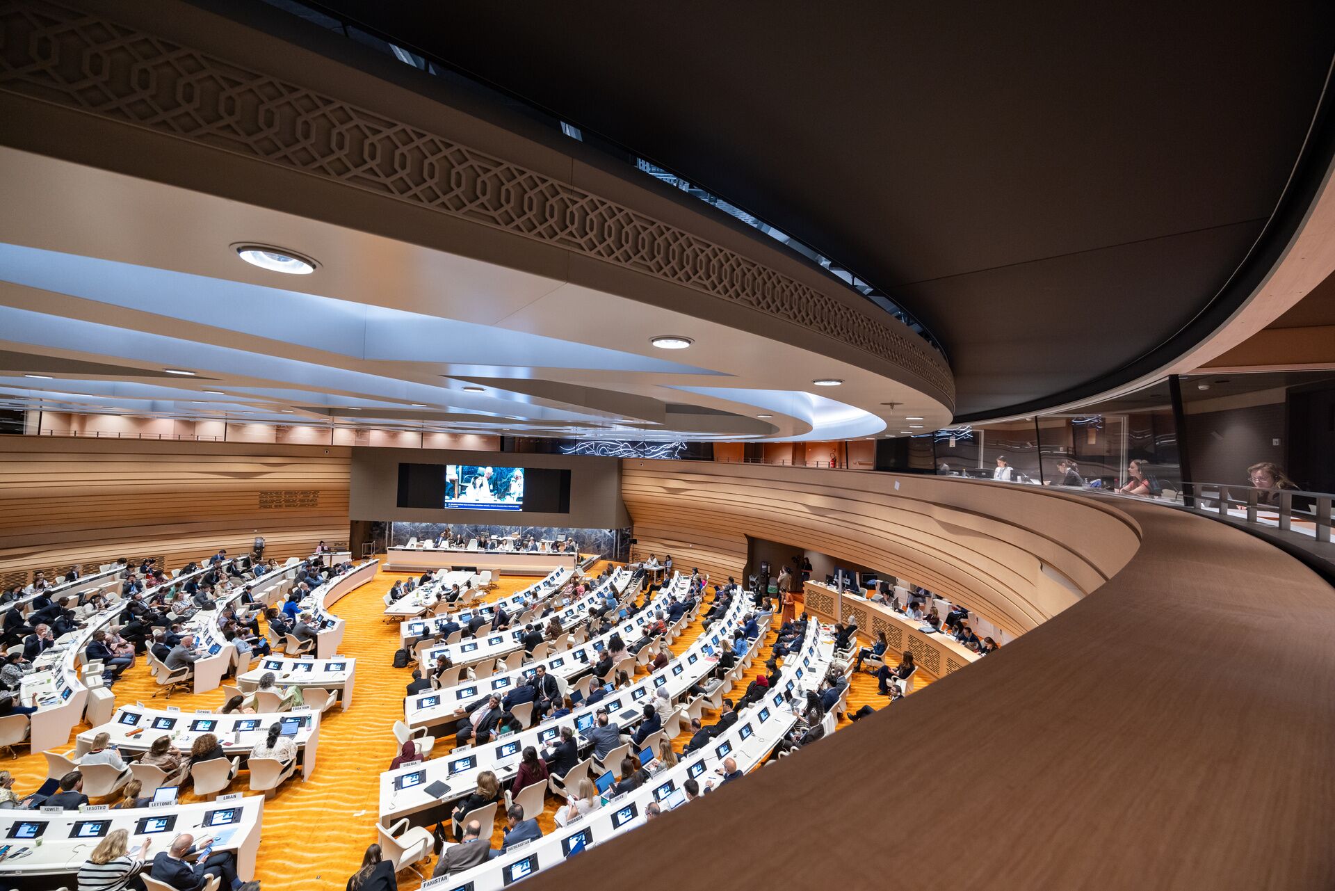 Overview from above of a conference auditorium and the interpreter boots.