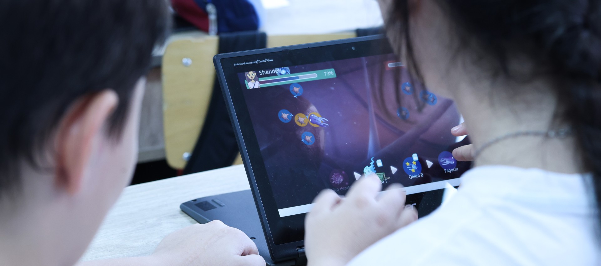 Immune Patrol game-based education package Two students play the Immune Patrol digital game on a laptop during a lesson.