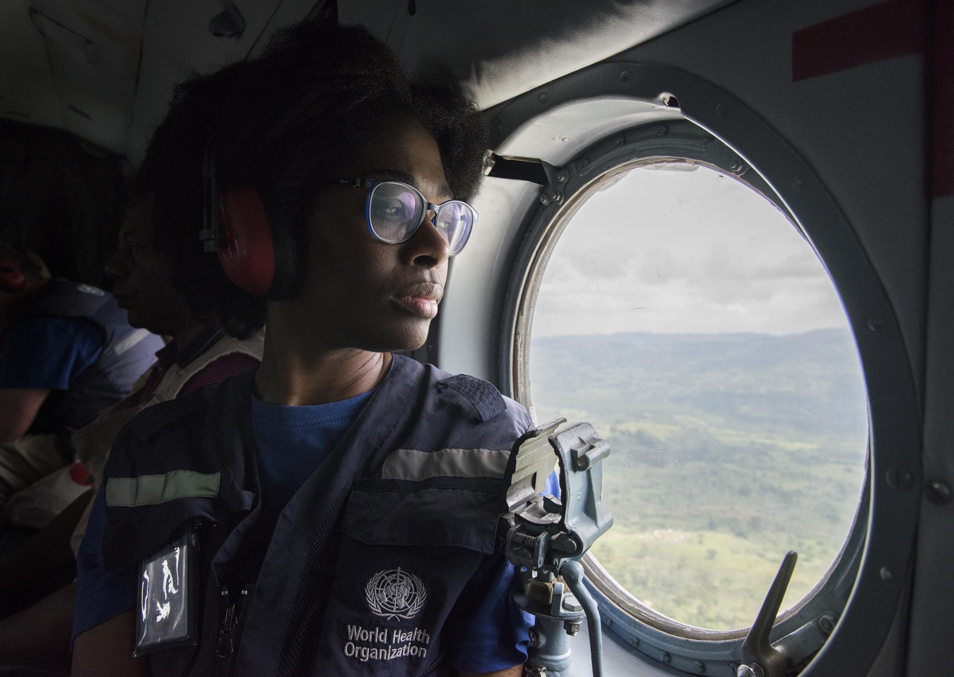 a WHO epidemiologist travelling in a plane