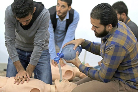 People practicing first aid