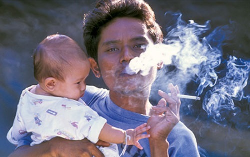 Smoking with child nearby is dangerous for them